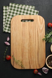 Photo of Cutting board, fresh tomatoes and different spices on grey textured table, flat lay