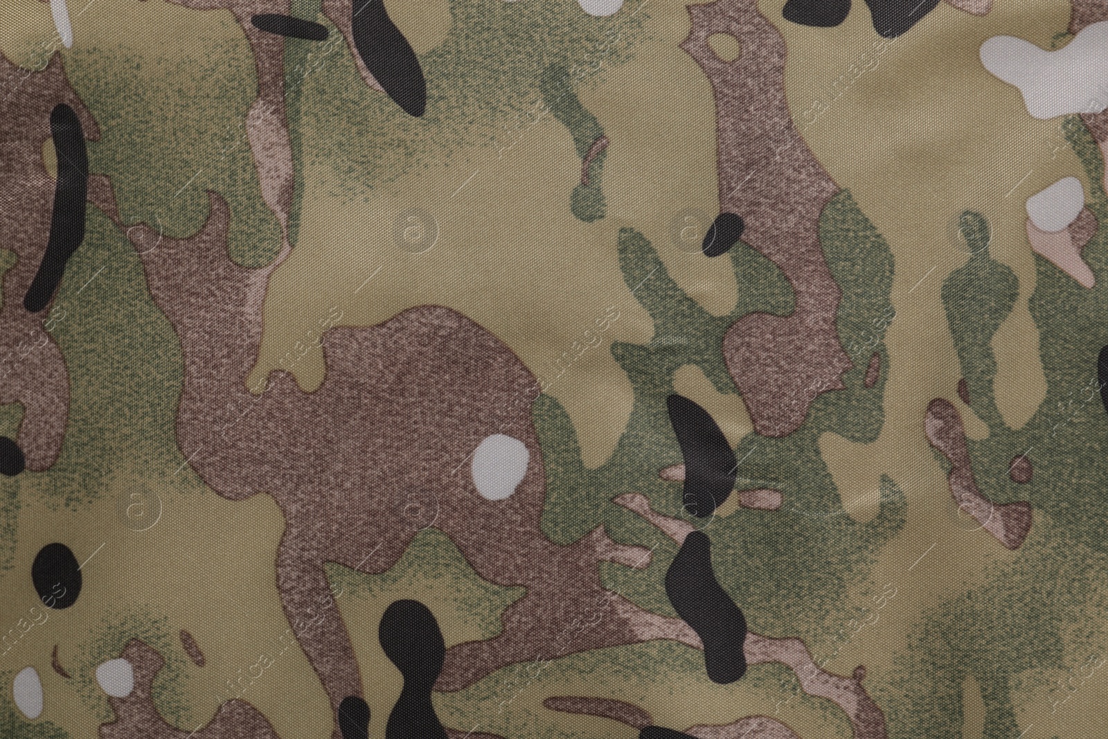 Photo of Texture of camouflage fabric as background, top view