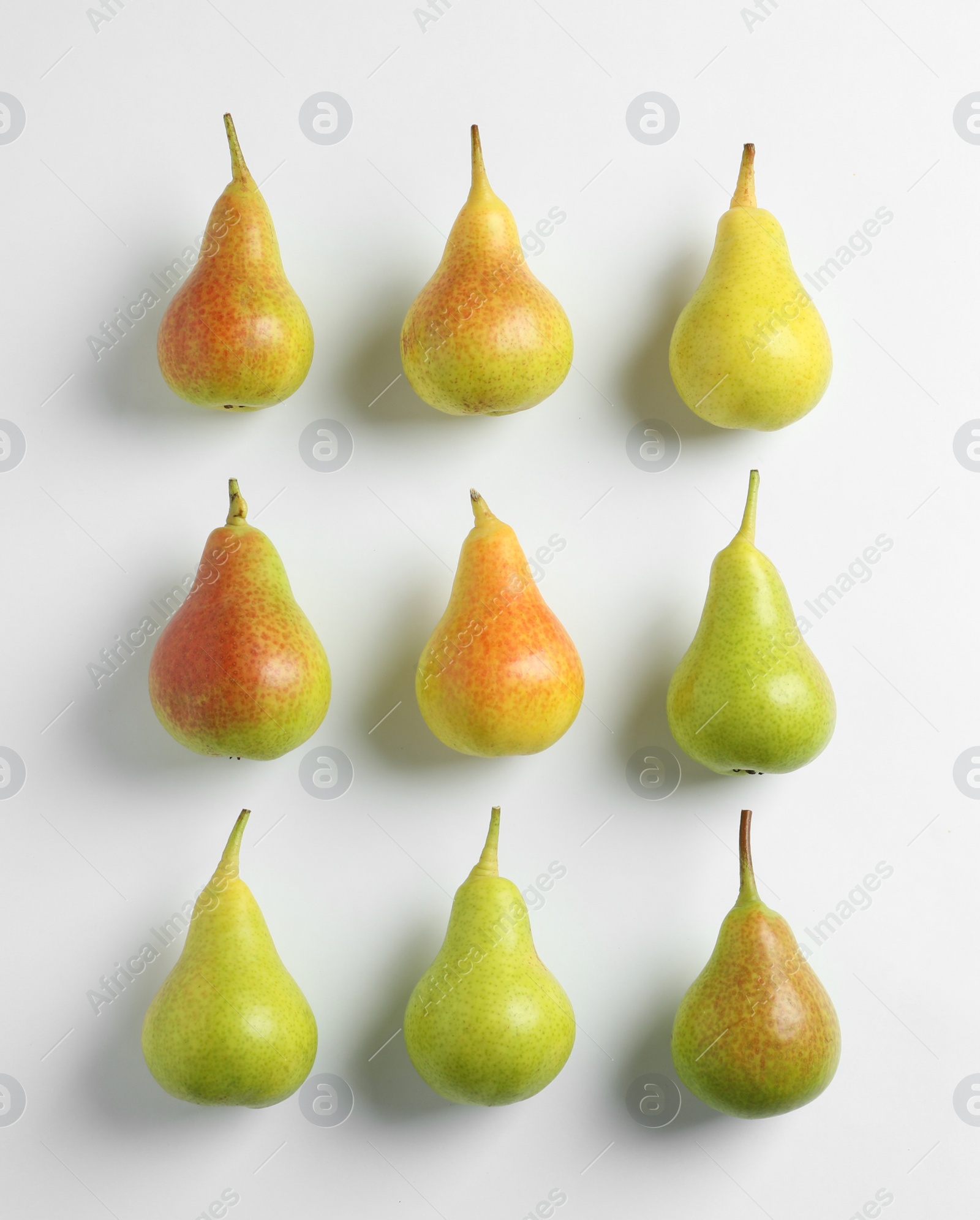 Photo of Fresh pears on light background, flat lay composition