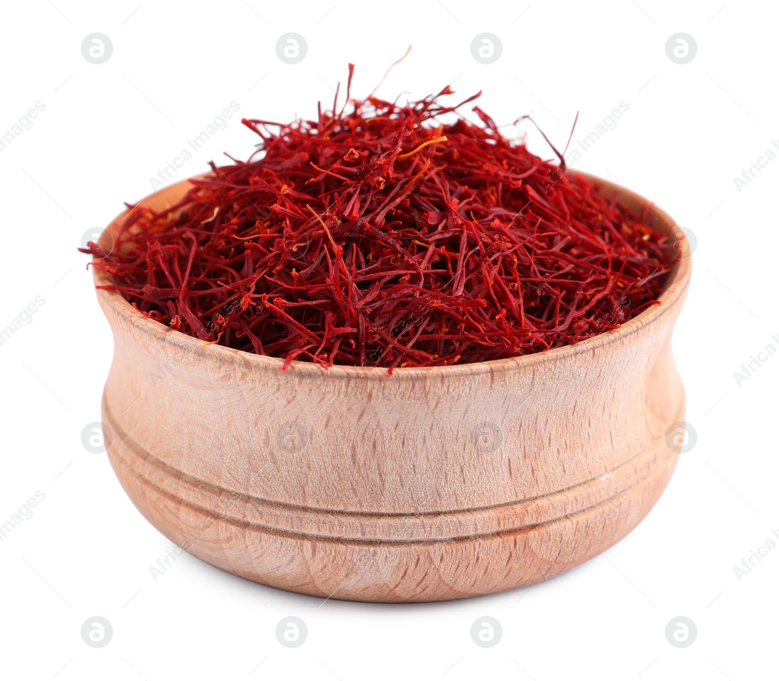 Photo of Dried saffron in wooden bowl isolated on white
