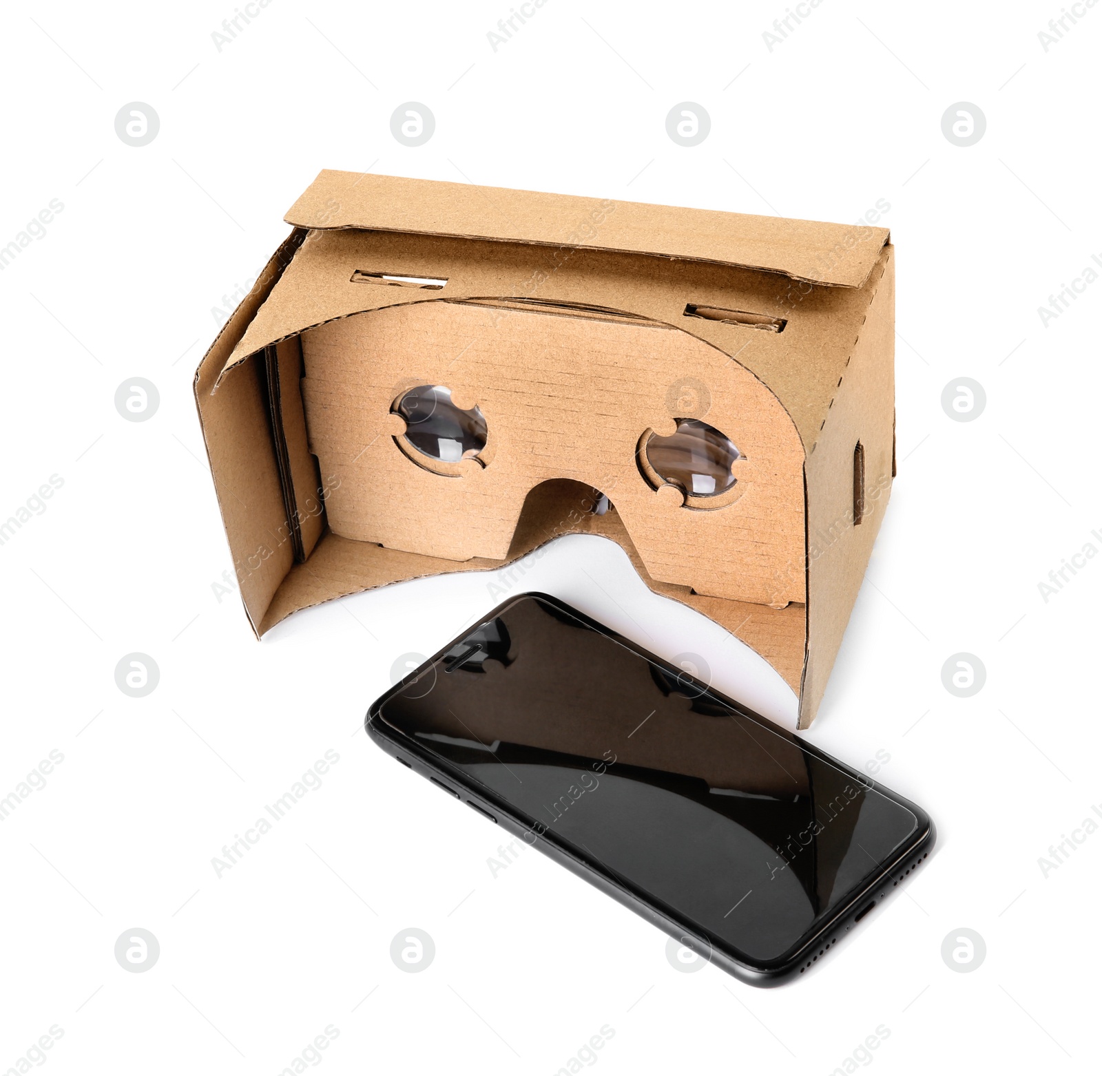 Photo of Cardboard virtual reality headset and smartphone on white background