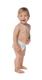 Photo of Cute baby in diaper learning to walk on white background