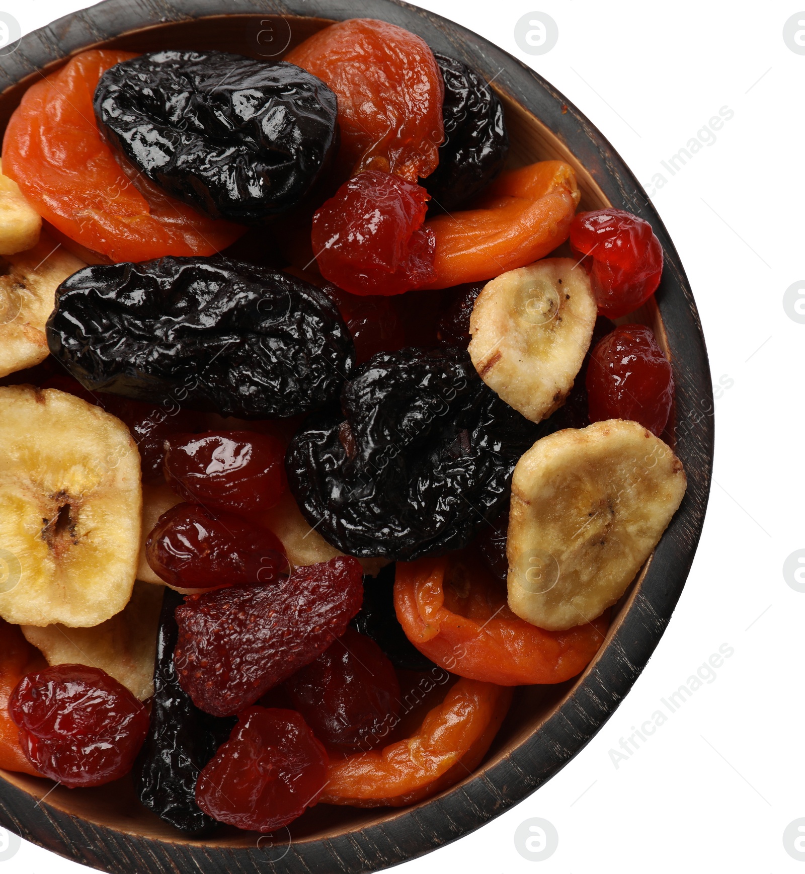 Photo of Mix of delicious dried fruits in bowl isolated on white, top view