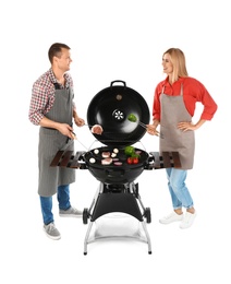 Happy couple cooking on barbecue grill, white background