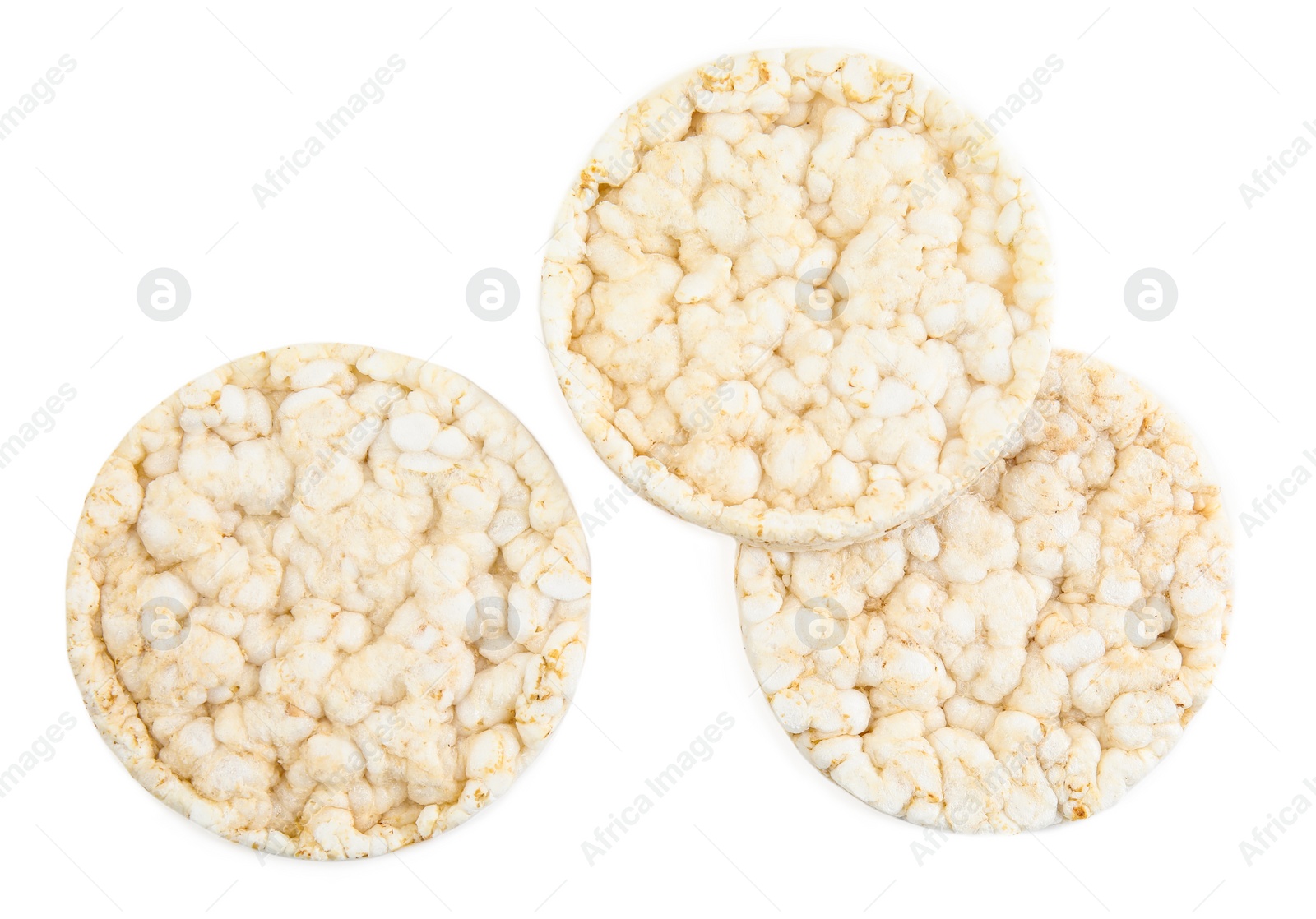 Photo of Puffed rice cakes isolated on white, top view. Healthy snack