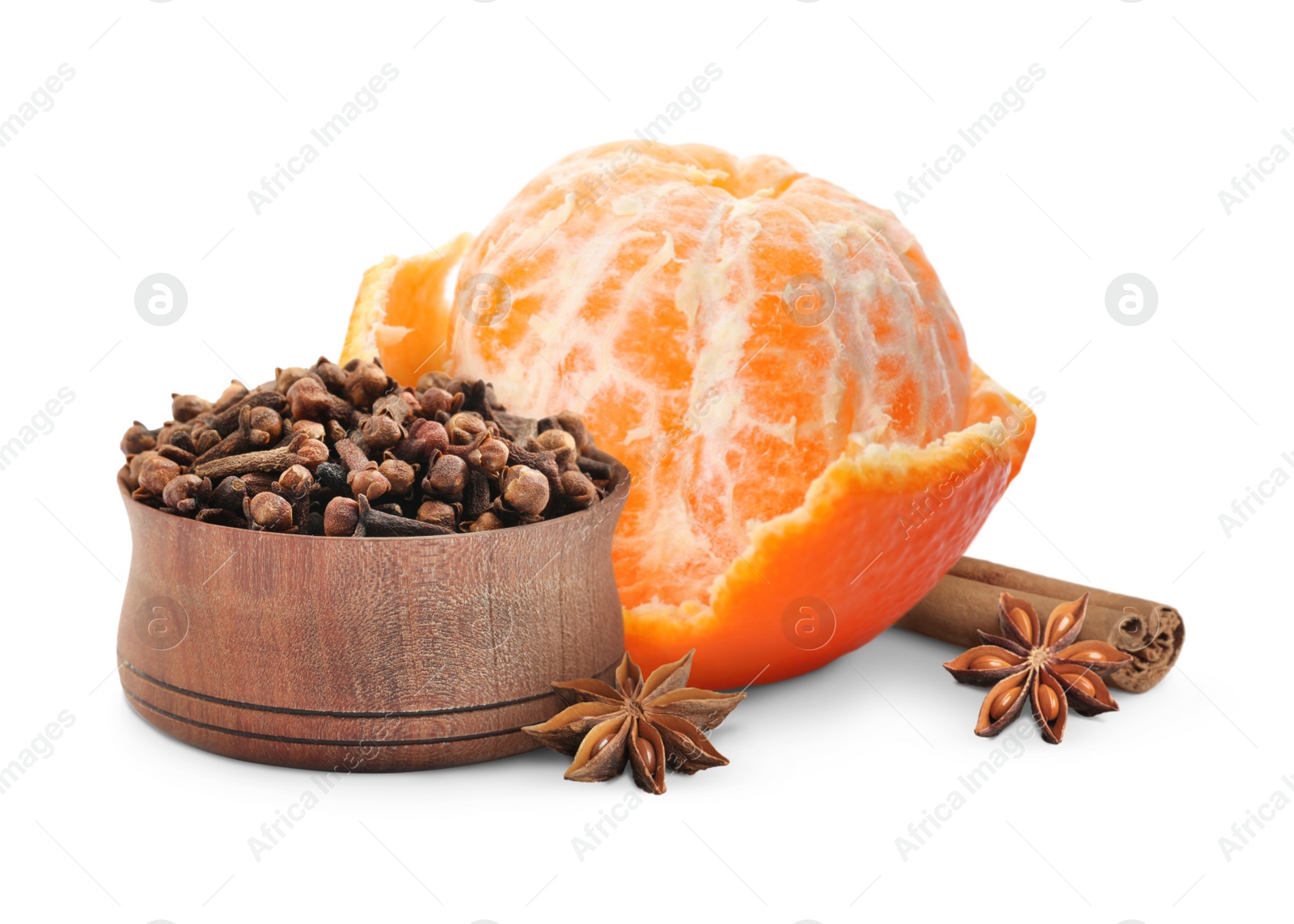 Image of Fresh ripe tangerine, cinnamon, anises and cloves in wooden bowl on white background