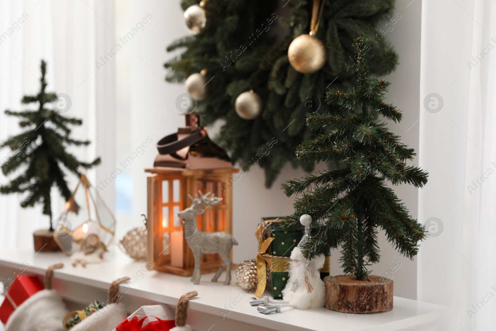 Photo of Different Christmas decorations in room. Interior design