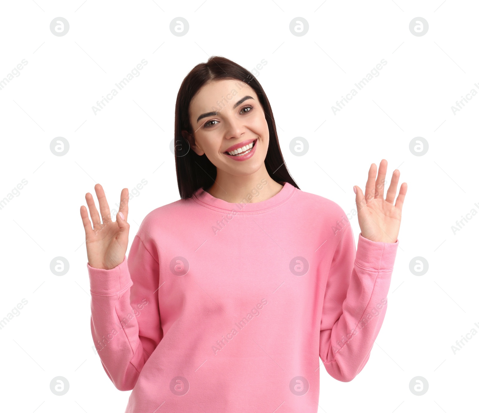 Photo of Attractive young woman showing hello gesture on white background