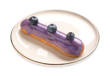 Delicious eclair decorated with blueberries isolated on white