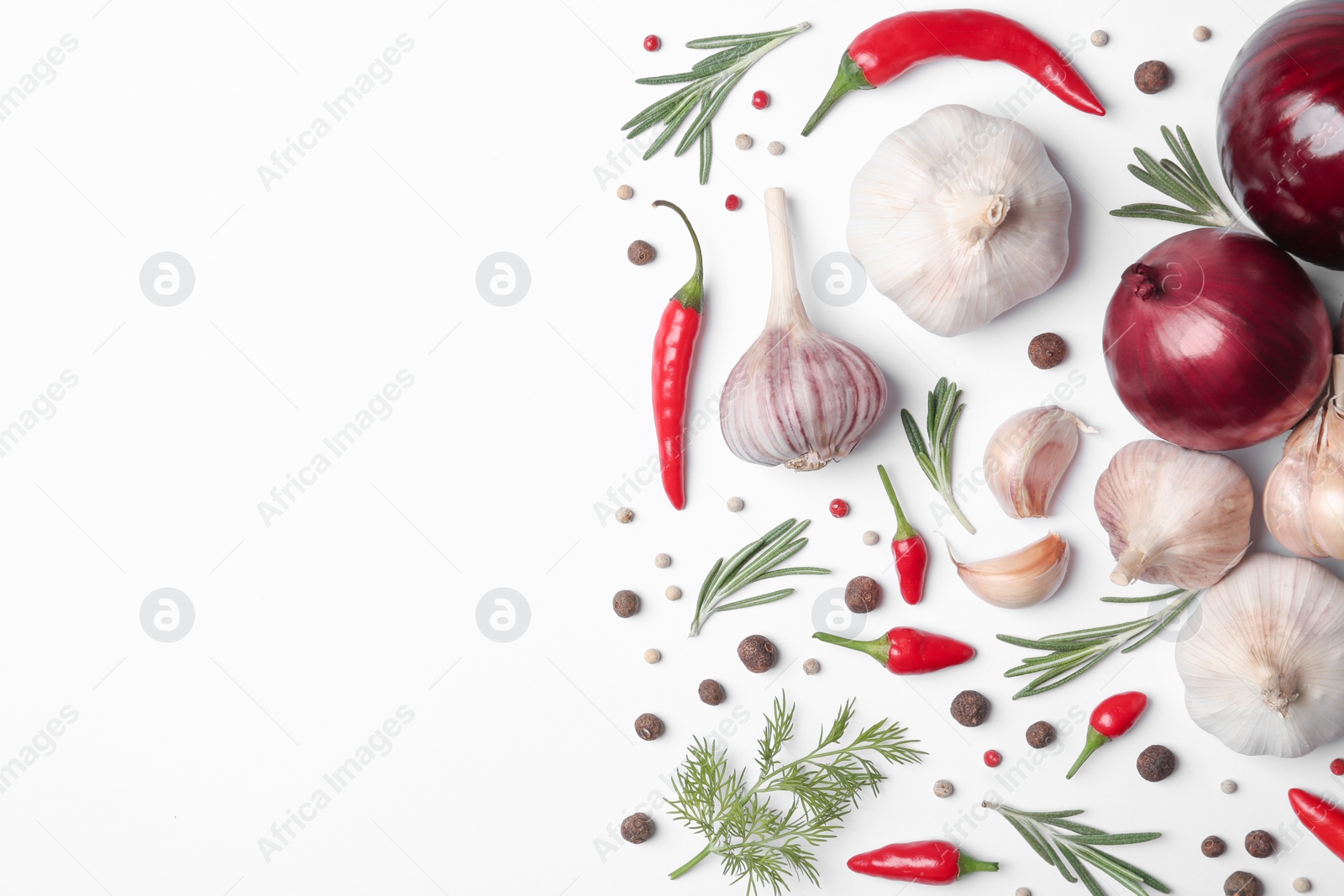 Photo of Composition with garlic, peppers and onions on white background, top view. Space for text