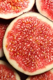 Pieces of fresh ripe figs as background, top view