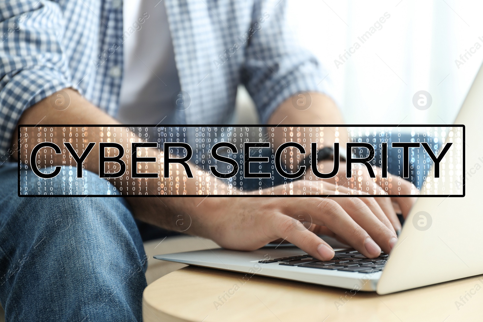 Image of Cyber security concept. Man working with laptop at table indoors, closeup