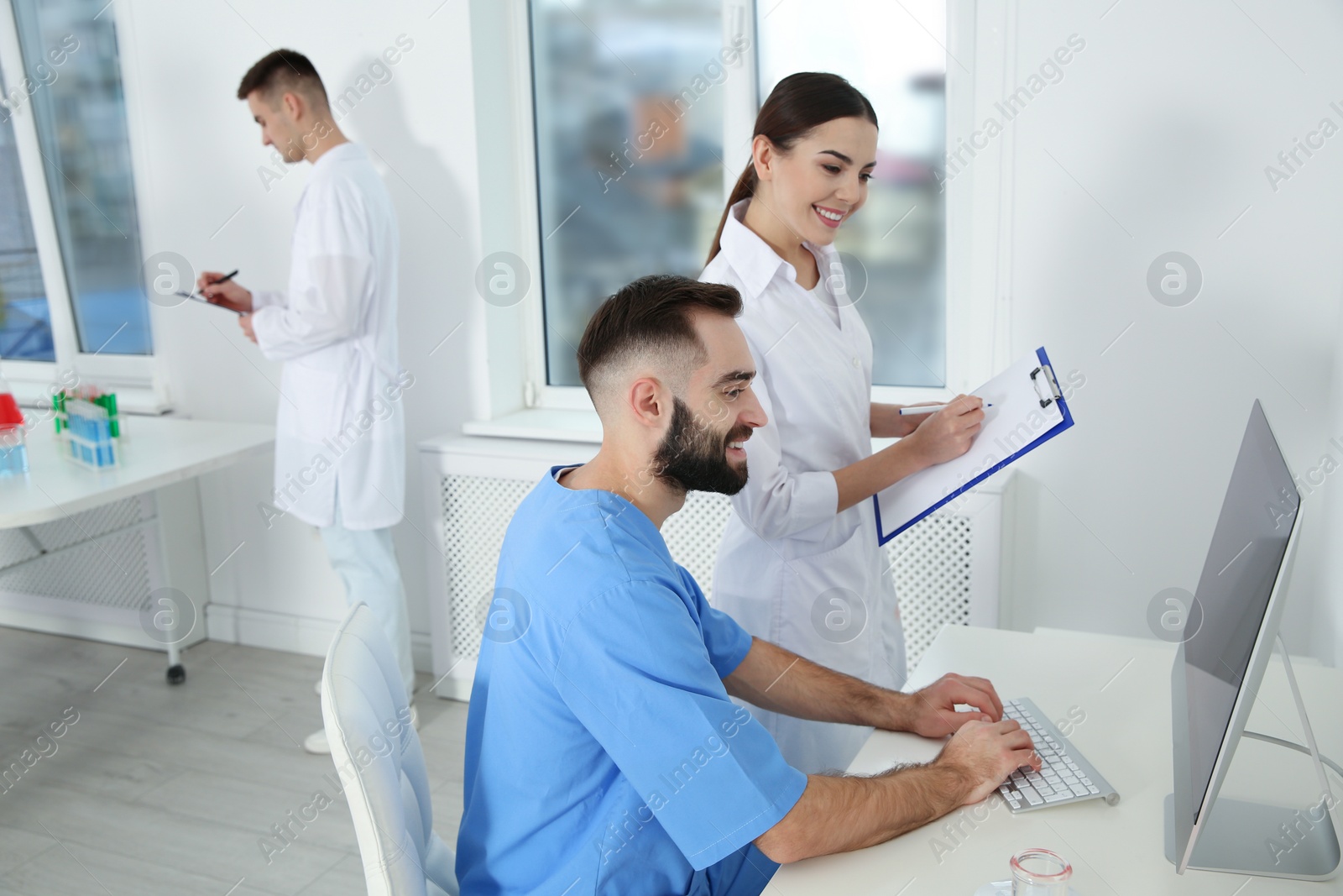 Photo of Medical students working in modern scientific laboratory