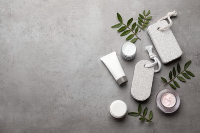 Photo of Flat lay composition with pumice stones on grey background. Space for text