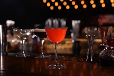 Photo of Glass of fresh Martini cocktail on bar counter