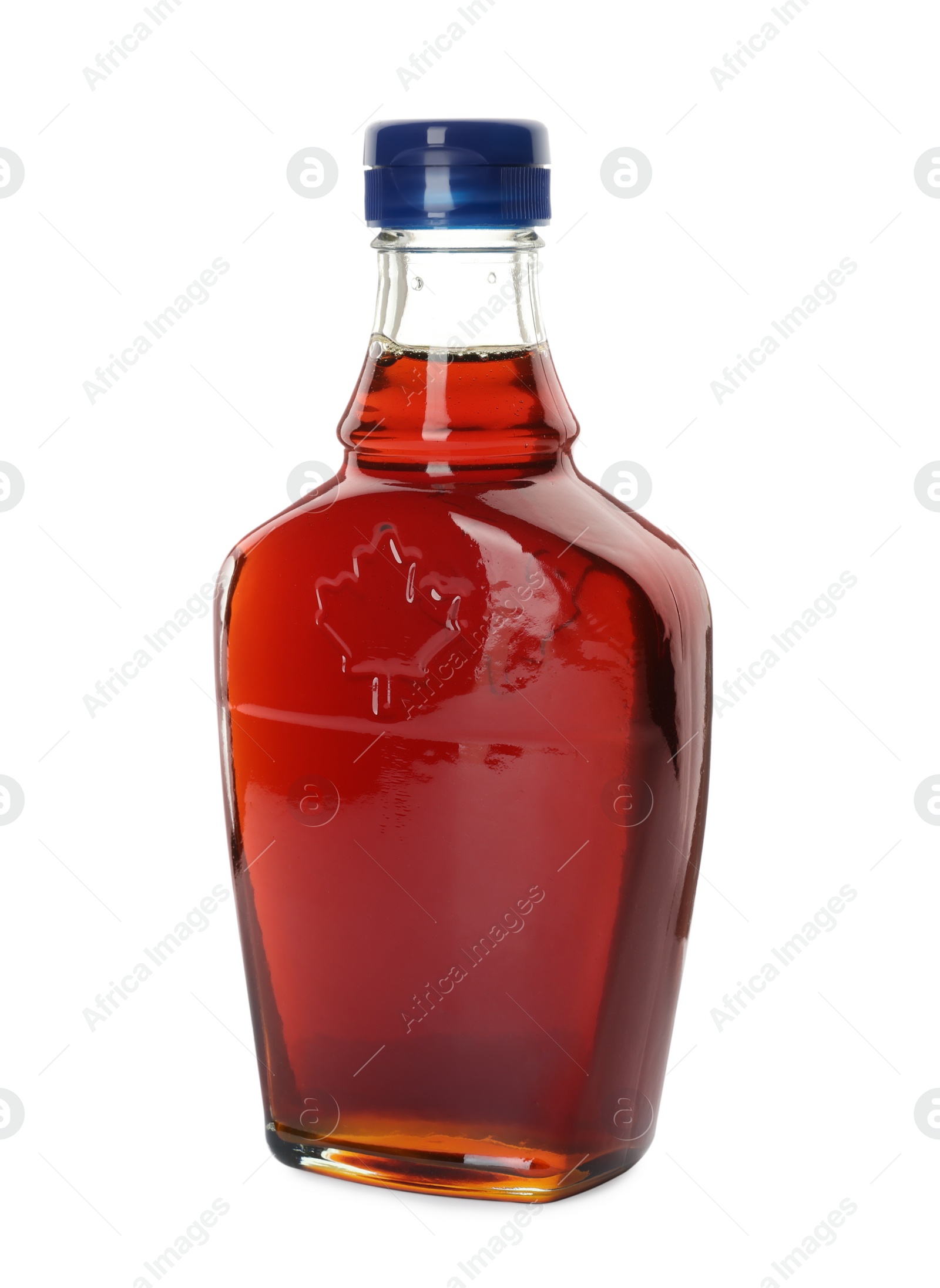 Photo of Bottle of tasty maple syrup isolated on white