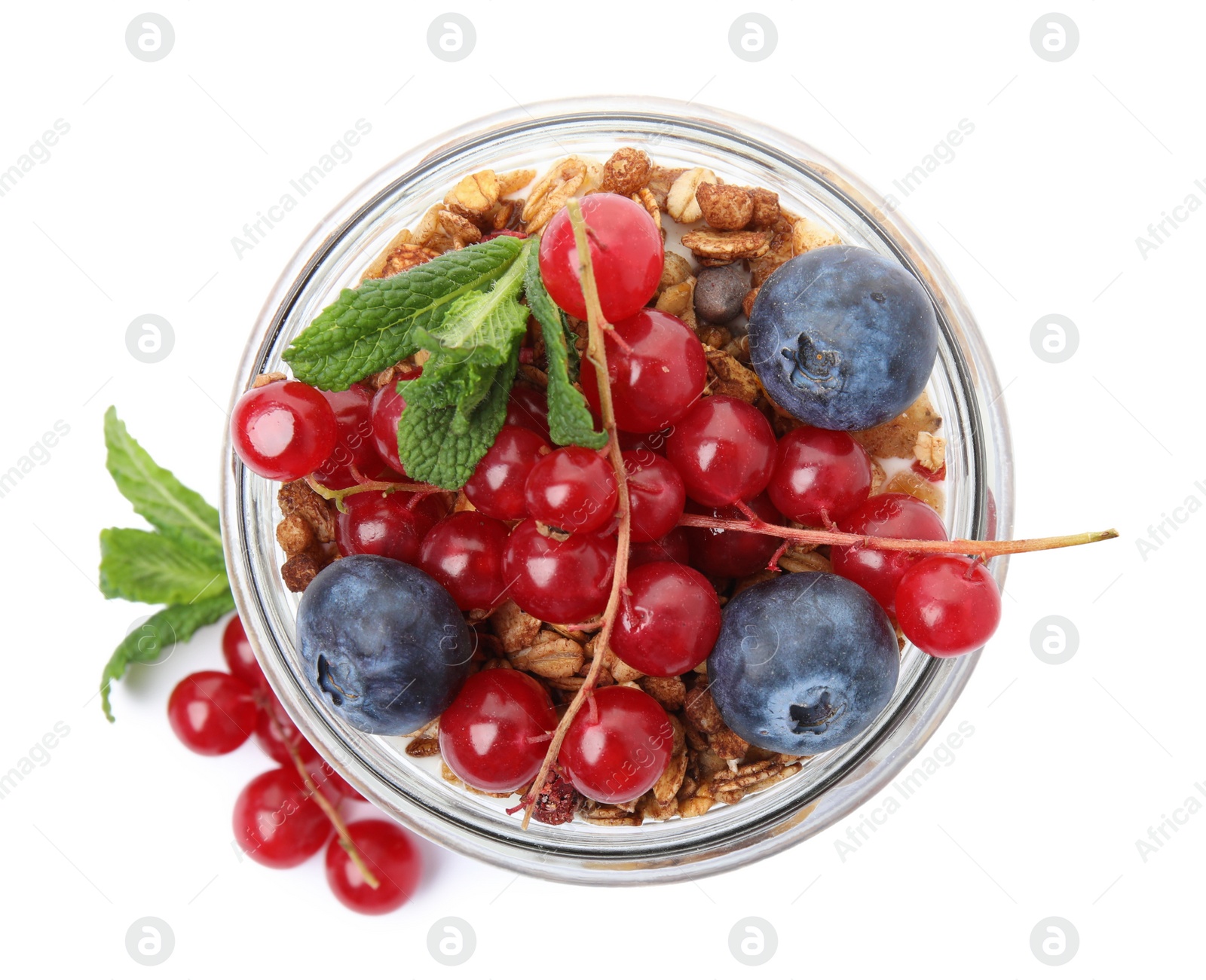 Photo of Delicious yogurt parfait with fresh berries and mint on white background, top view