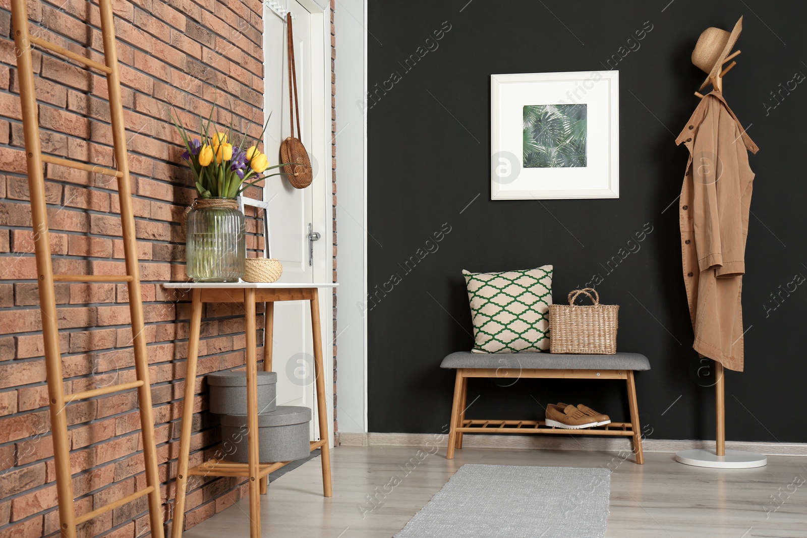 Photo of Hallway interior with stylish table and bench