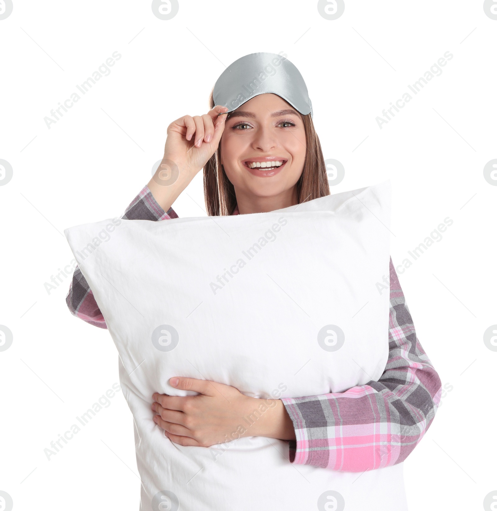 Photo of Young woman with pillow and sleep mask on white background