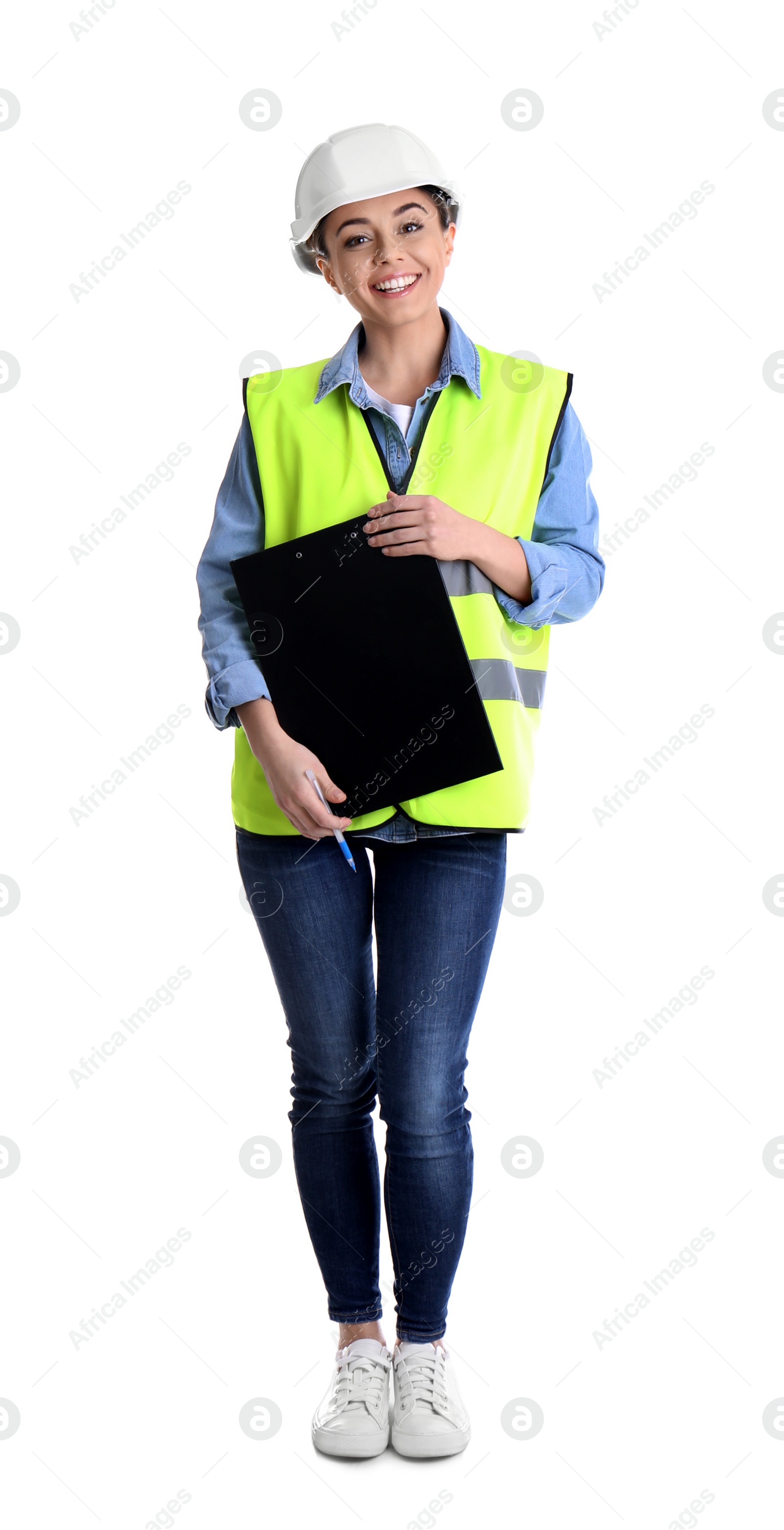 Photo of Female industrial engineer in uniform with clipboard on white background. Safety equipment