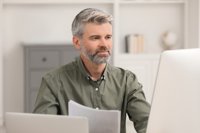 Professional accountant working on computer in office