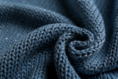 Photo of Beautiful pale blue knitted fabric as background, closeup