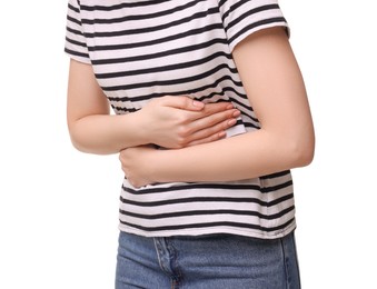Photo of Young woman suffering from stomach pain on white background, closeup