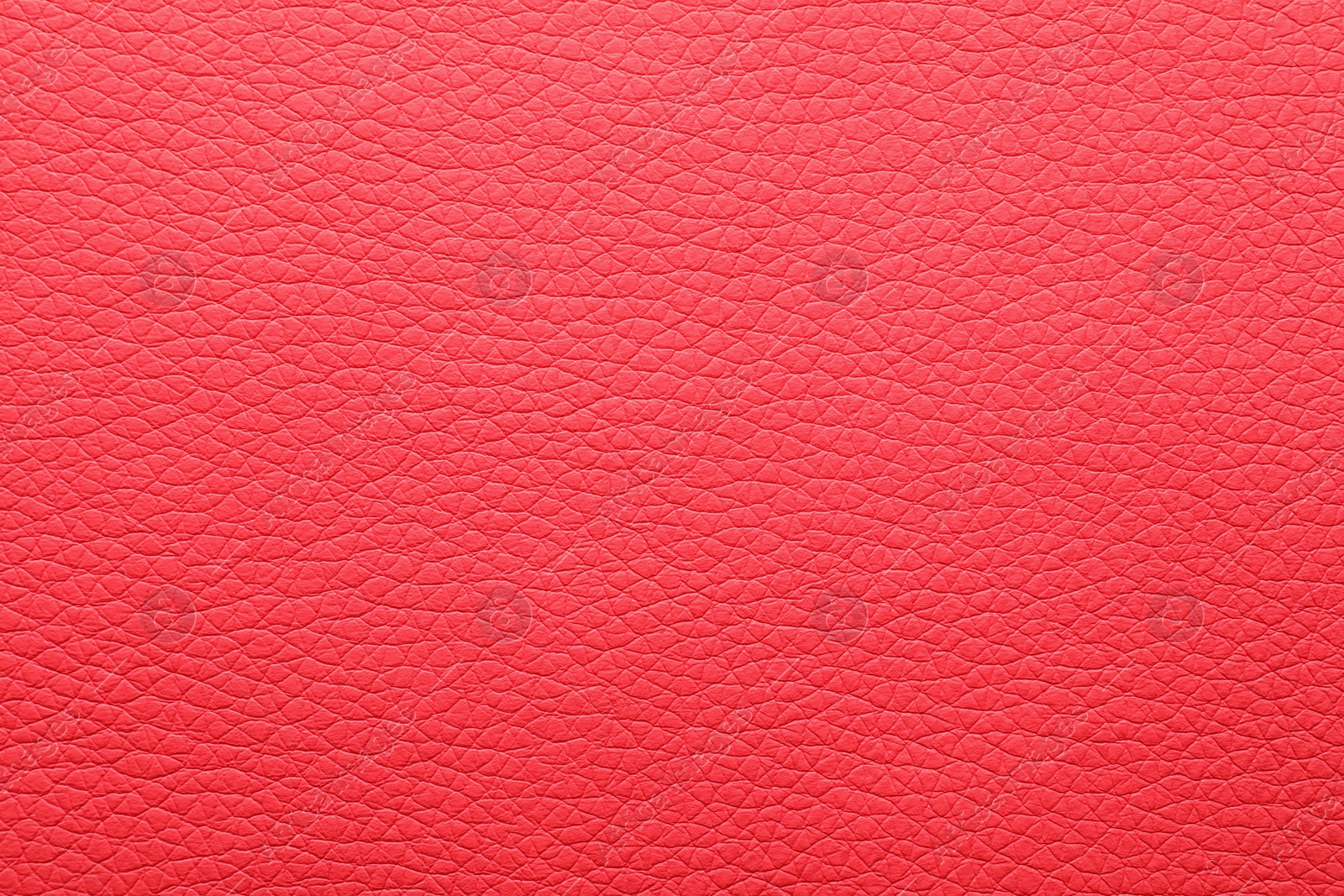 Photo of Texture of red leather as background, closeup