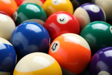 Photo of Many colorful billiard balls as background, closeup