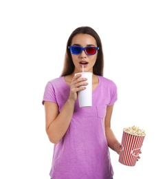 Photo of Emotional woman with 3D glasses, popcorn and beverage during cinema show on white background