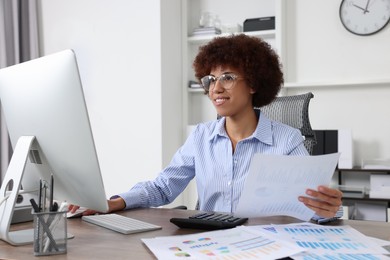 Professional accountant working on computer in office