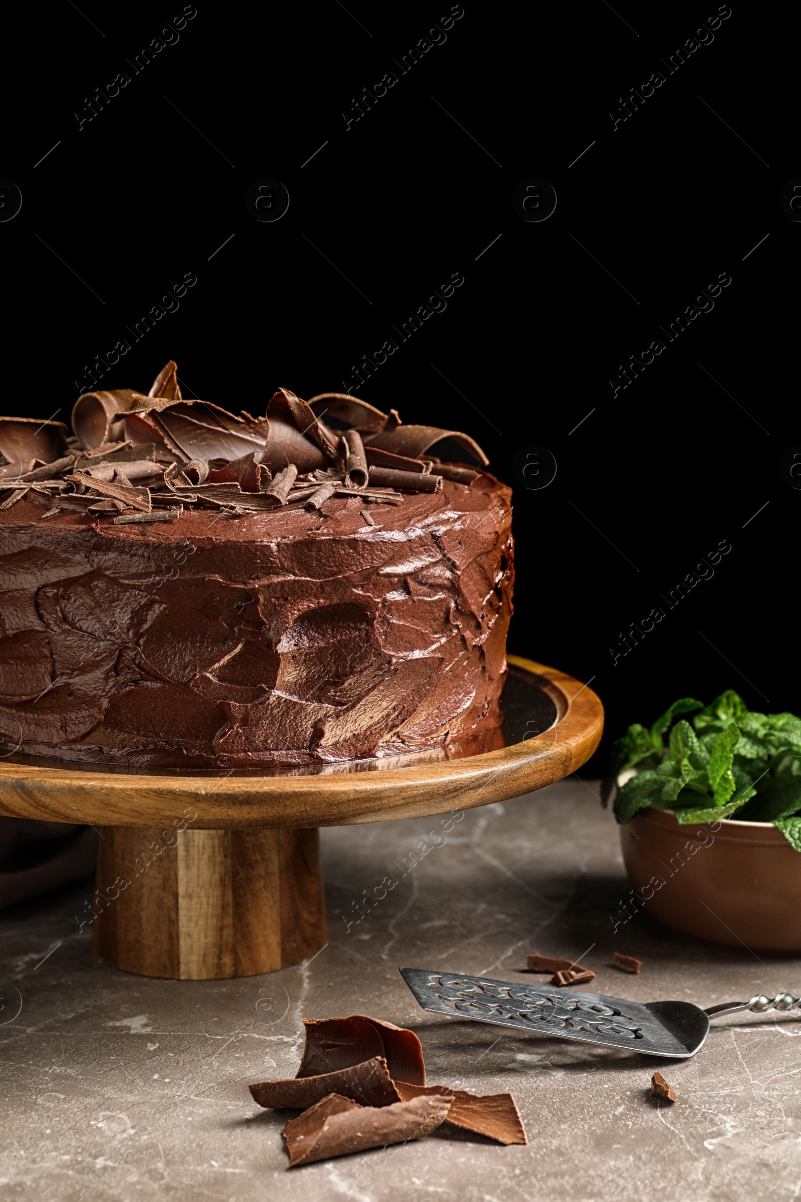 Photo of Composition with tasty homemade chocolate cake on table