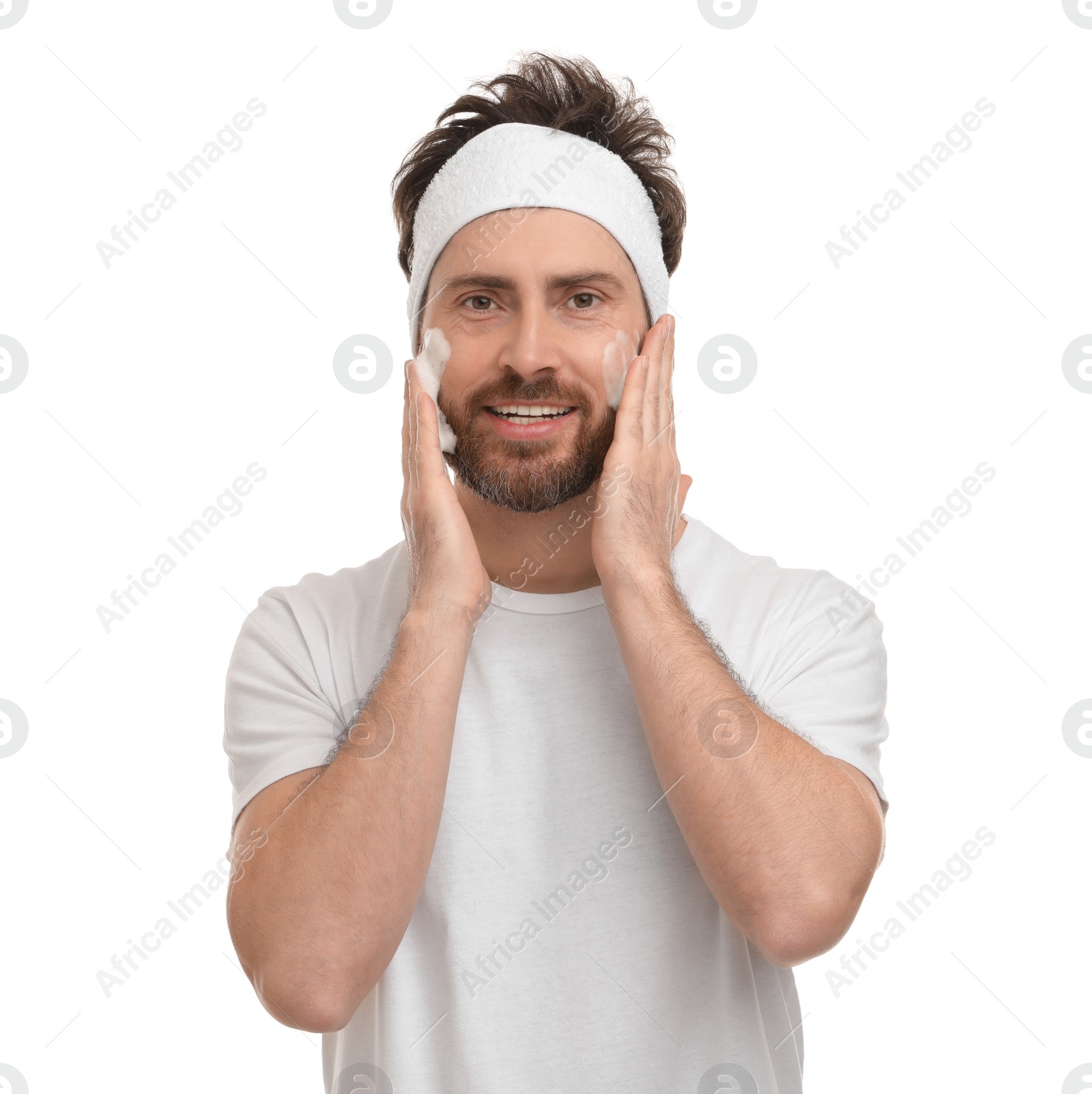 Photo of Man with headband washing his face on white background