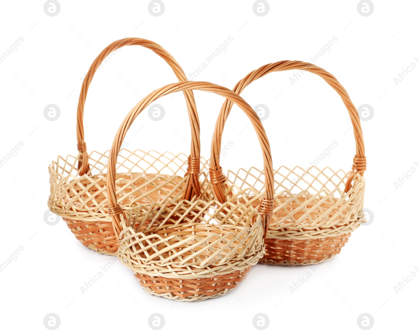 Photo of Three decorative wicker baskets on white background