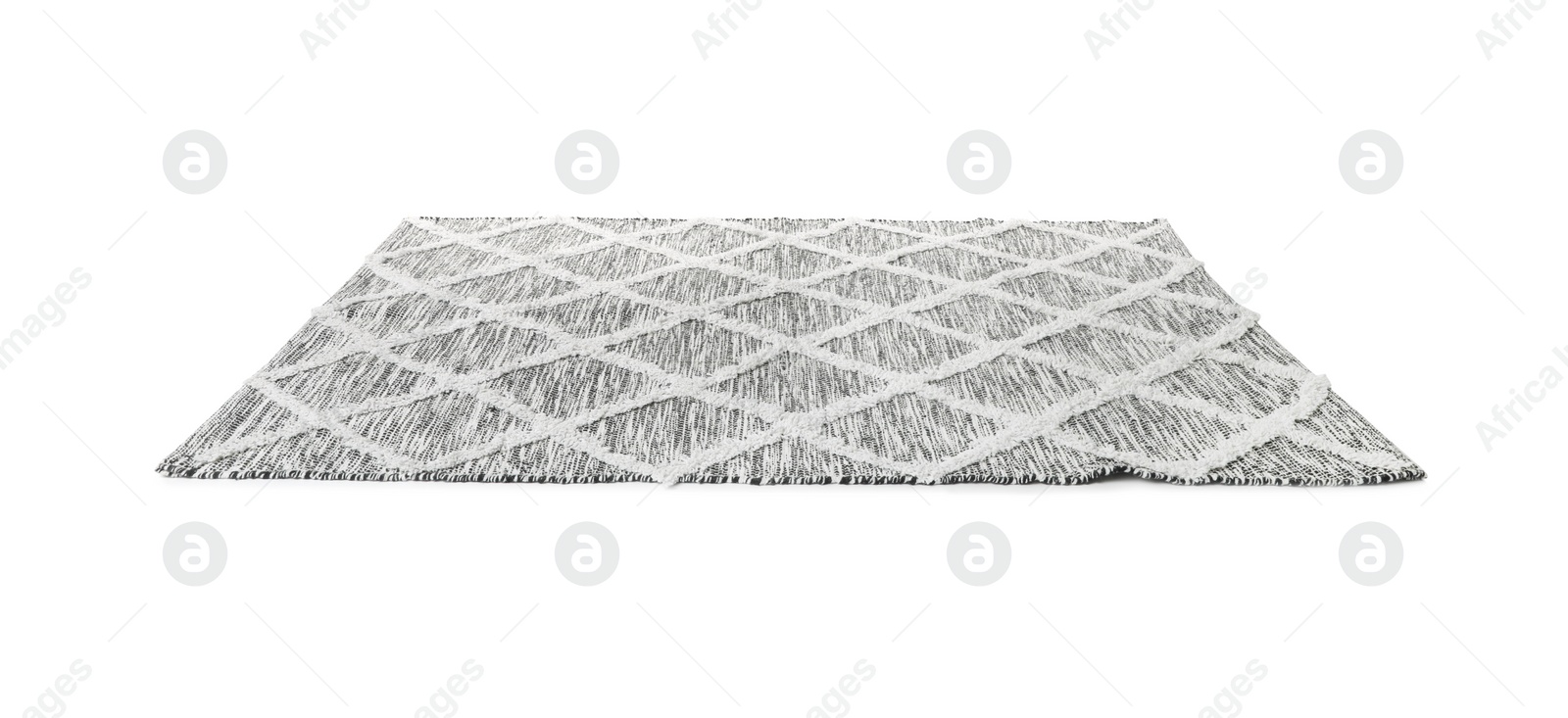 Photo of Stylish grey rug isolated on white. Interior accessory