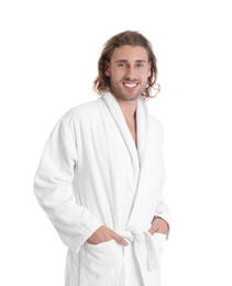 Young man in bathrobe on white background