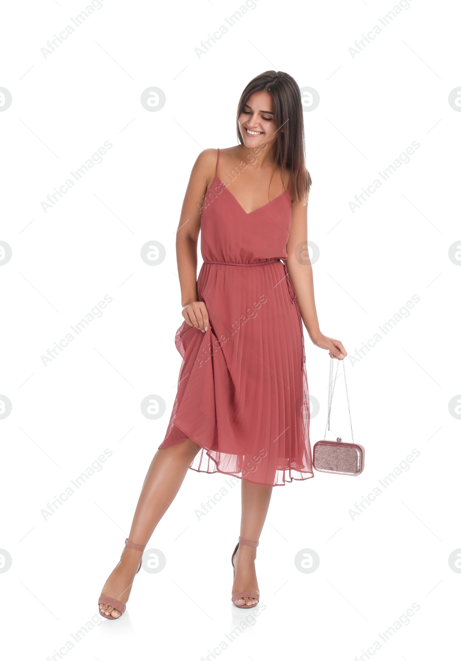 Photo of Young woman wearing stylish pale pink dress on white background