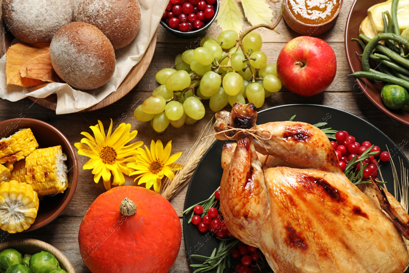 Photo of Flat lay composition with turkey on wooden background. Happy Thanksgiving day