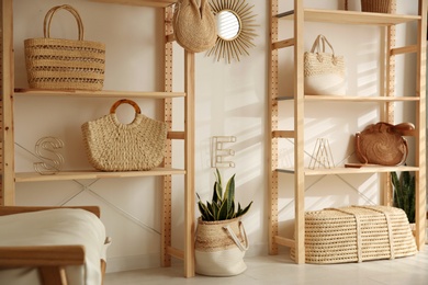 Stylish woman's bags on shelves in boutique