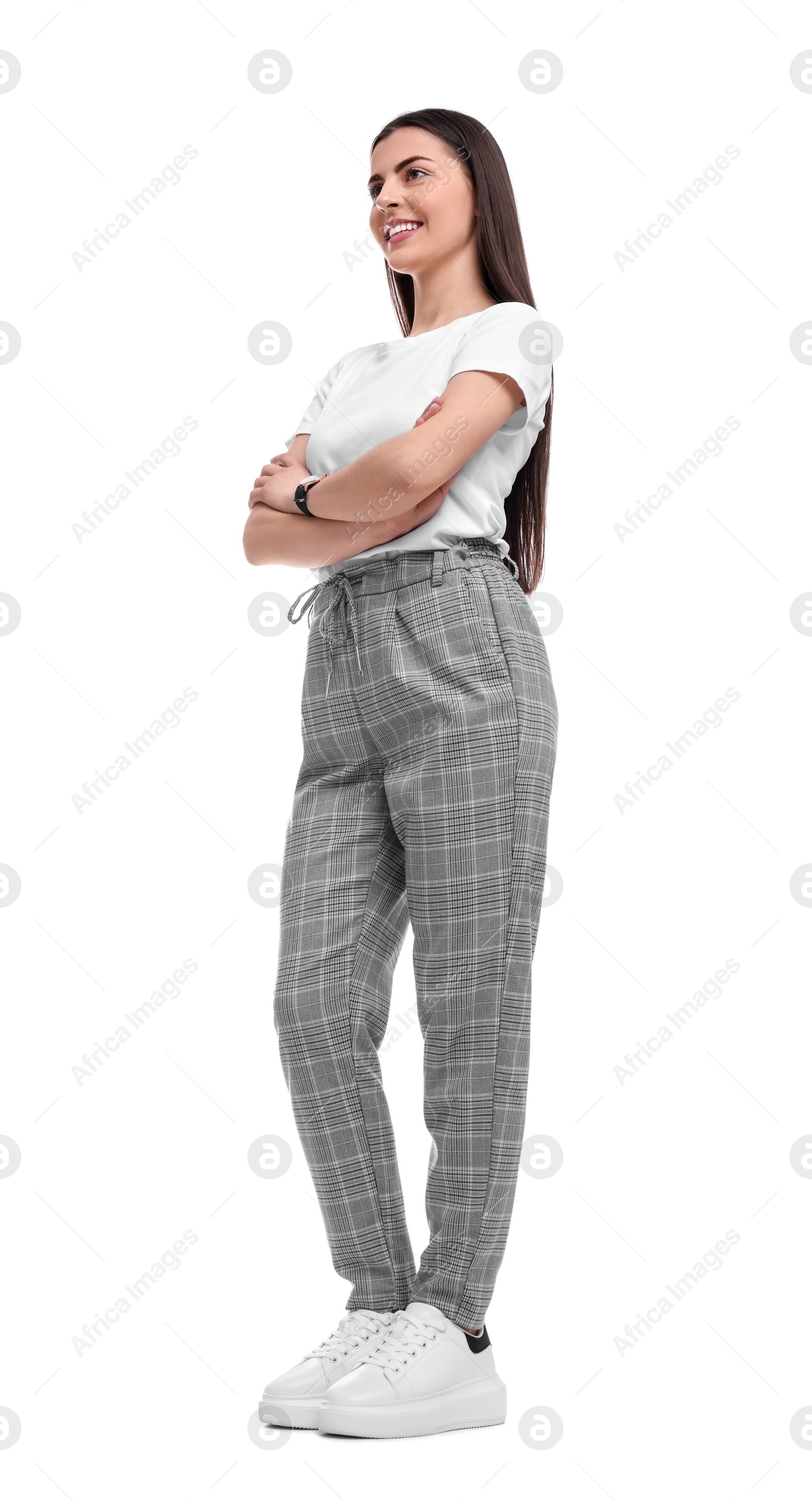 Photo of Beautiful young businesswoman crossing arms on white background