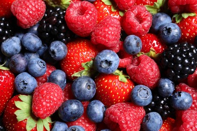 Assortment of fresh ripe berries as background, top view