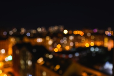 Photo of Blurred view of modern city at night. Bokeh effect