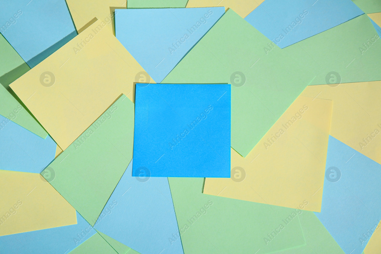 Photo of Many colorful stickers as background, top view