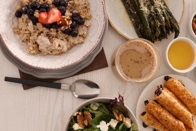 Many different dishes served on buffet table for brunch, flat lay