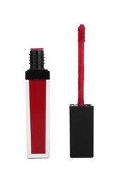Red lip gloss and applicator isolated on white. Cosmetic product