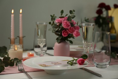 Photo of Romantic table setting with flowers and candles