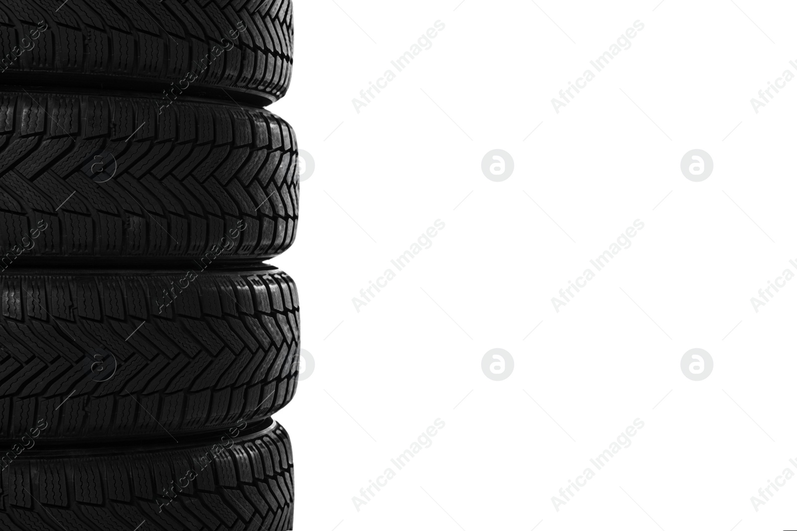 Photo of Set of new winter tires on white background