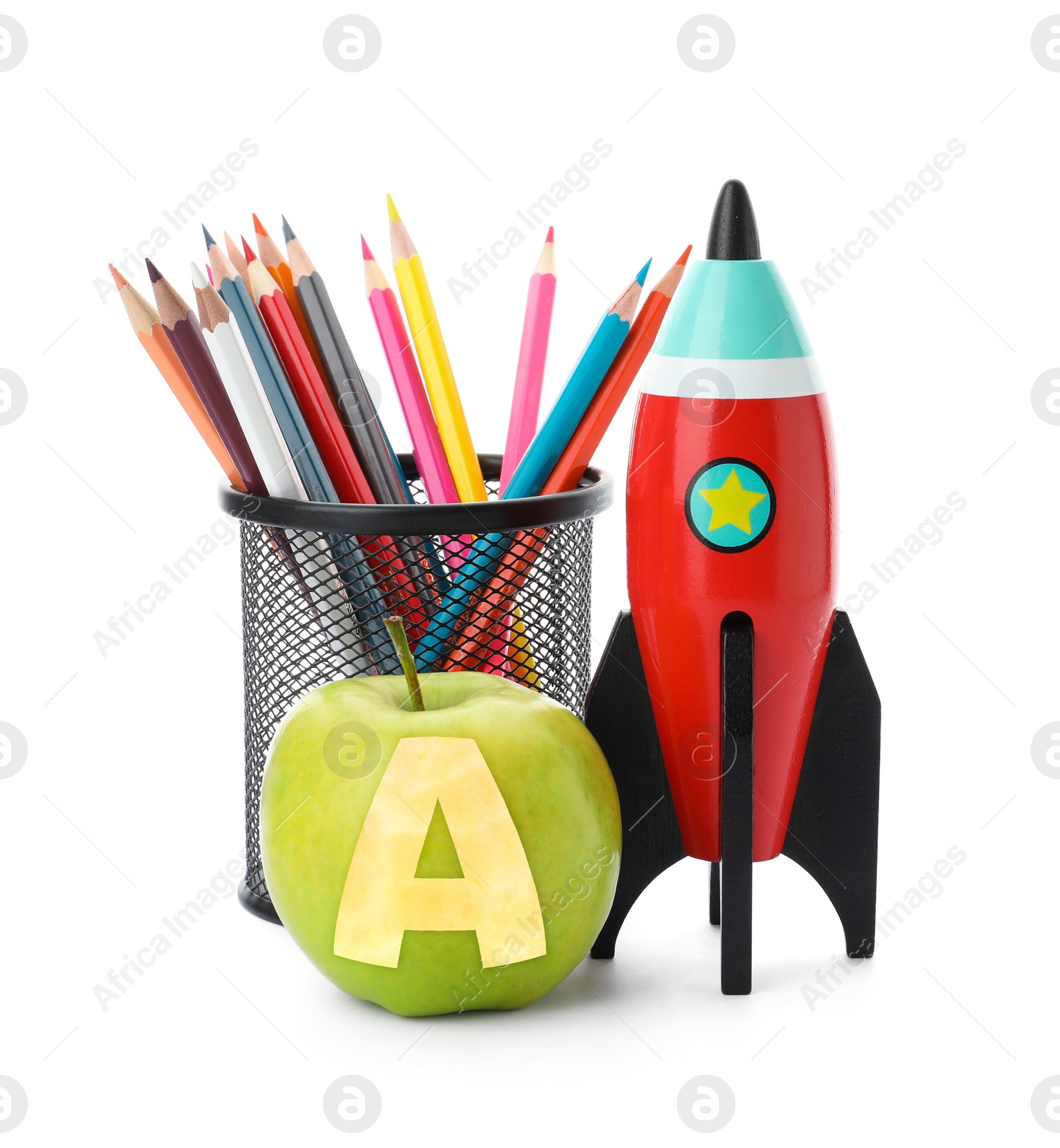 Image of Apple with carved letter A as school grade. Bright toy rocket and pencils on white background