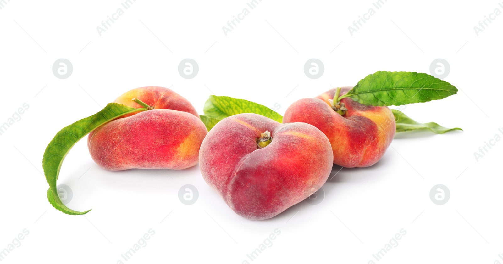 Photo of Fresh donut peaches with leaves on white background