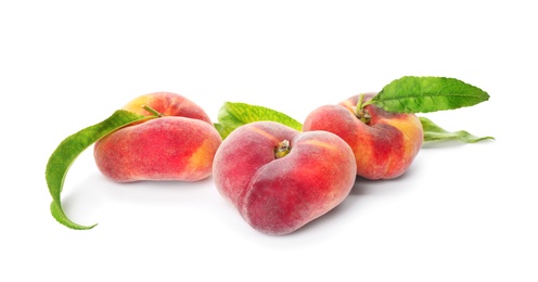 Photo of Fresh donut peaches with leaves on white background